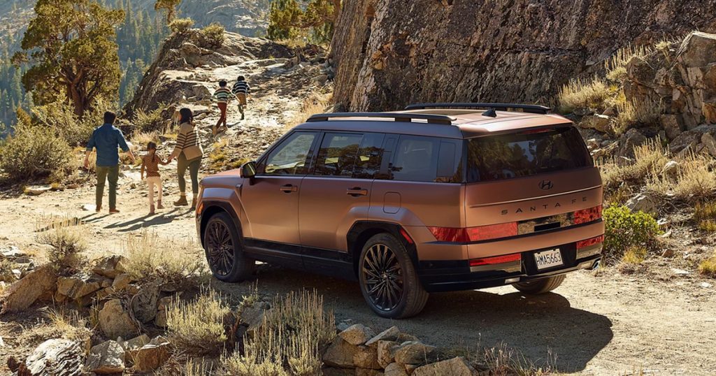 A Hyundai Santa Fe on a mountain trail.