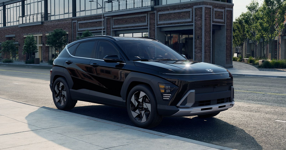 A Hyundai Kona parked on a city street.